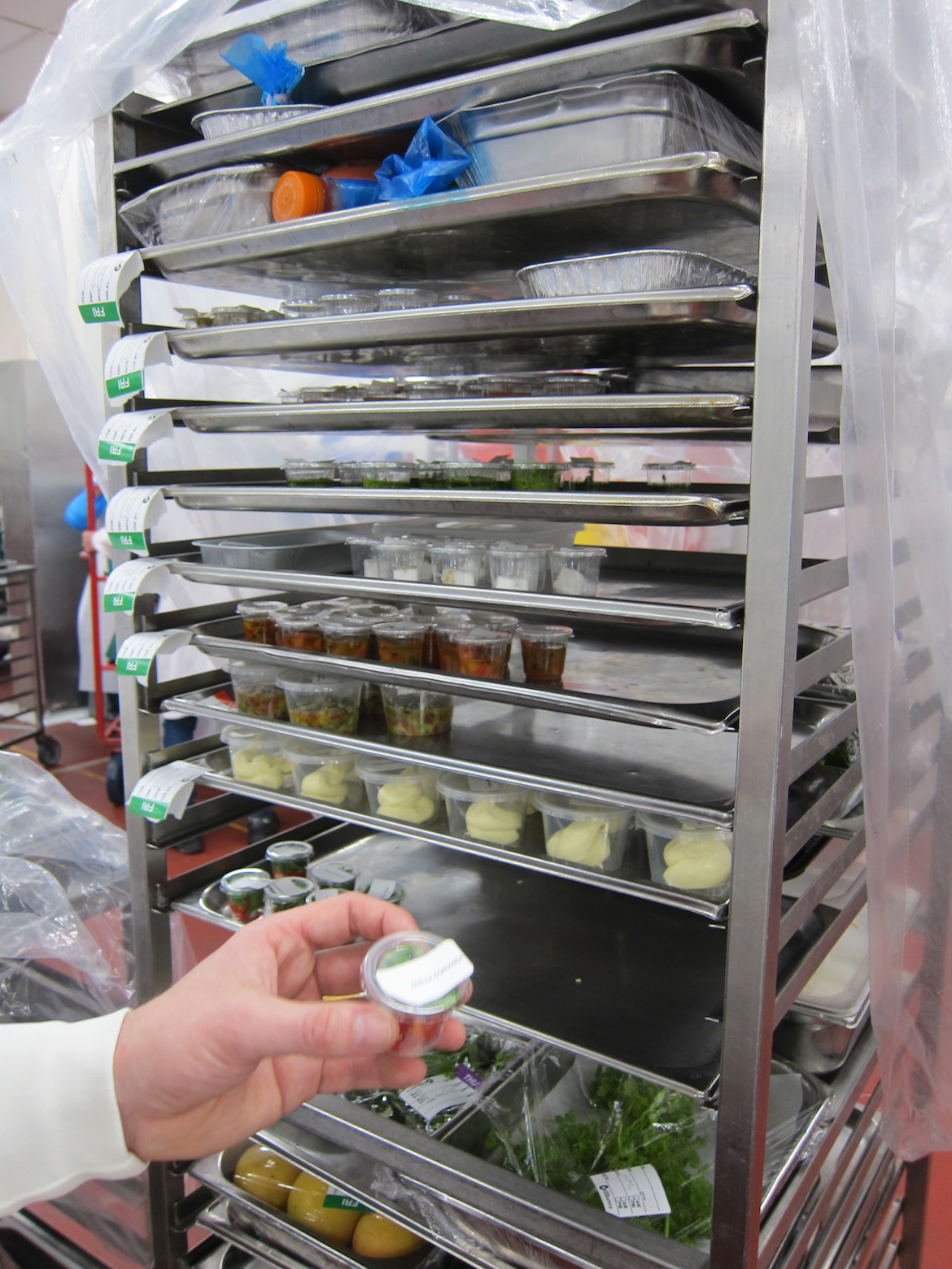 Every garnish or sauce is labelled and placed in individual tubs before going on board the aircraft. (Jordan Chong)