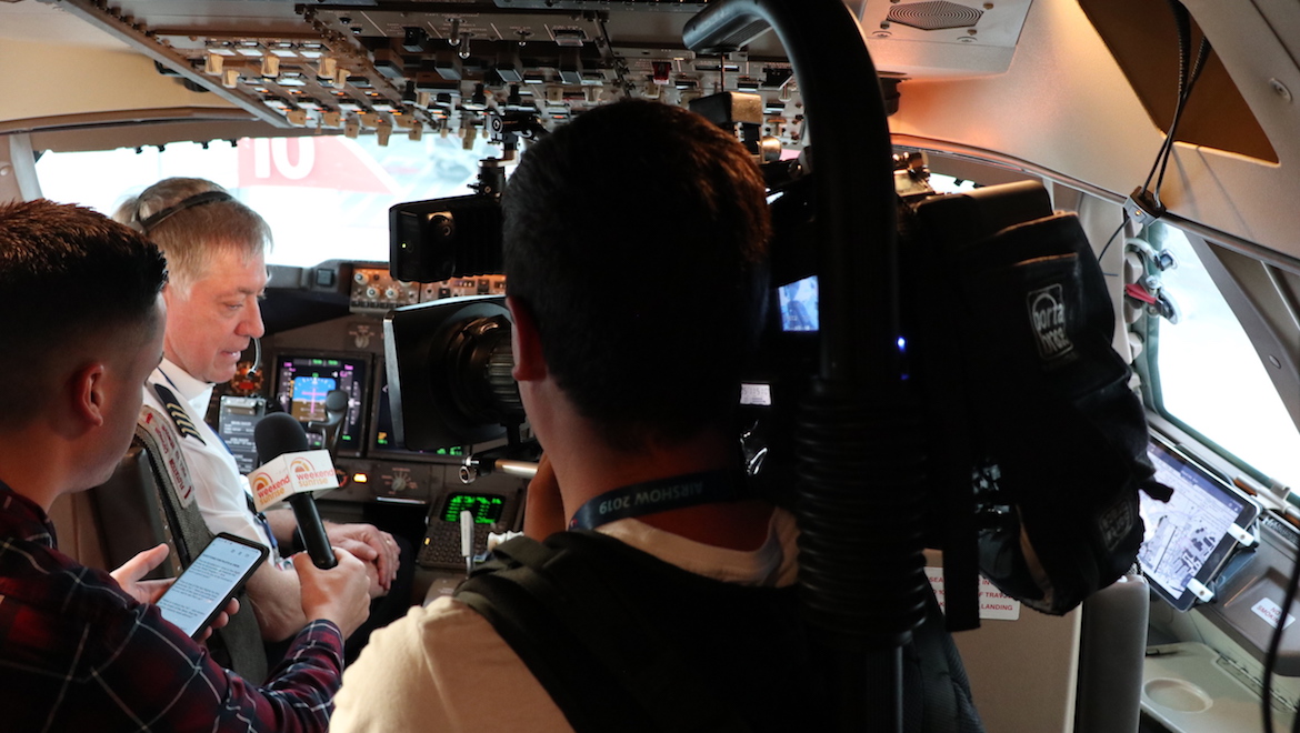 Qantas Captain Mark Kelly speaks with reporters in the flight deck of Boeing 747-400 VH-OJU at Avalon. (Owen Zupp)