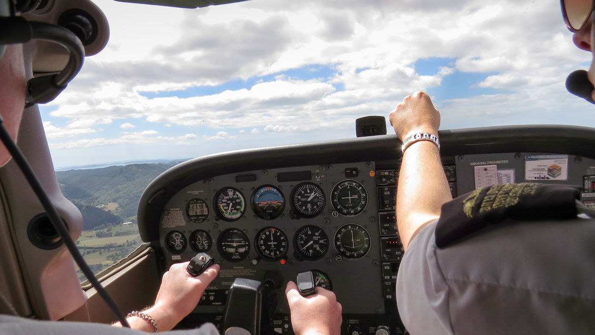 A student pilot taking a training flight under instruction.