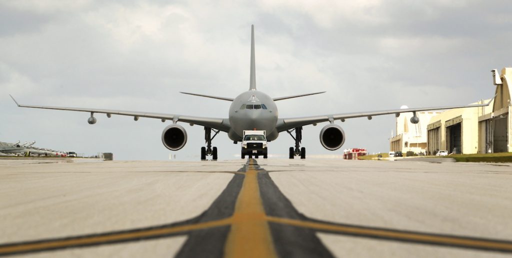 A KC-30 is directed to its parking hardstand by a USAF pick-up at Andersen Air Force Base, Guam. (Defence)
